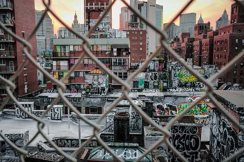 grey photo of brown concrete city buildings at daytime new york